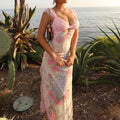 Maxi dress with floral lace and deep V-neck