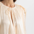Luna mini dress with pleats and lantern sleeves