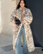 Warm luxurious women's faux fur coat with leopard print