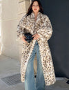 Warm luxurious women's faux fur coat with leopard print
