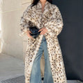 Warm luxurious women's faux fur coat with leopard print