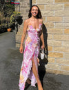 Maxi dress with irregular floral print and tassels