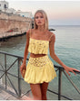 Pleated skirt with suspenders