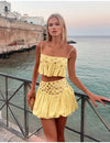 Pleated skirt with suspenders