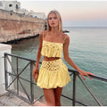 Pleated skirt with suspenders
