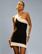 Dress with slanted shoulders and open back
