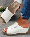 Comfortable leather sandals with a thick sole and arch support.