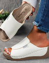 Comfortable leather sandals with a thick sole and arch support.