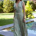 Isla Luxe – Printed jumpsuit with open back and wide legs